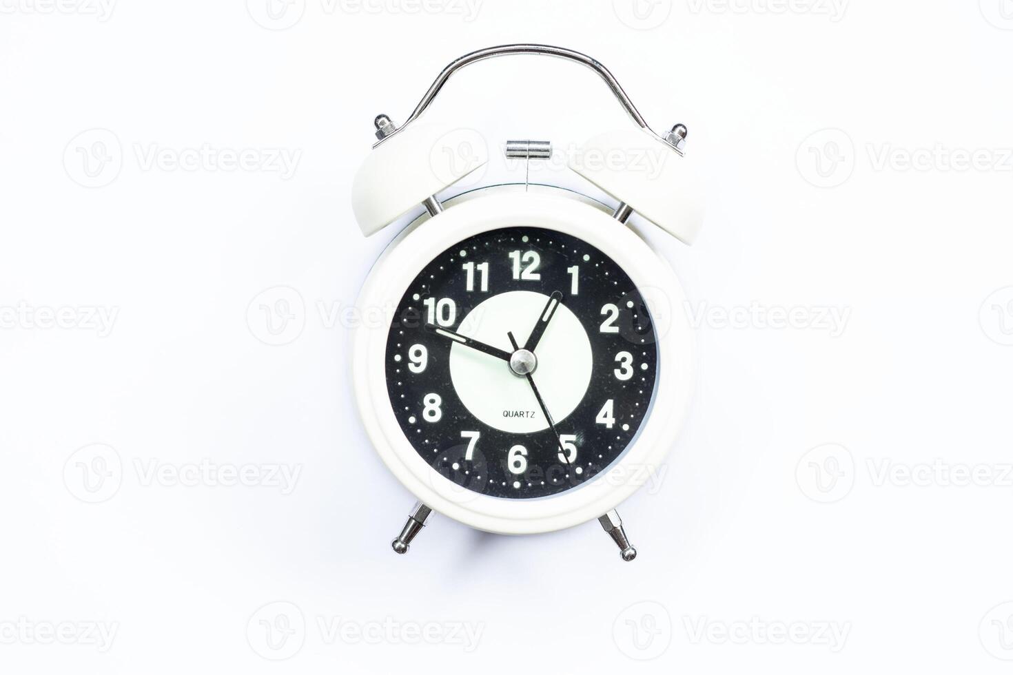 Ramadan concept alarm clock, hunger delay alarm white background top view. photo