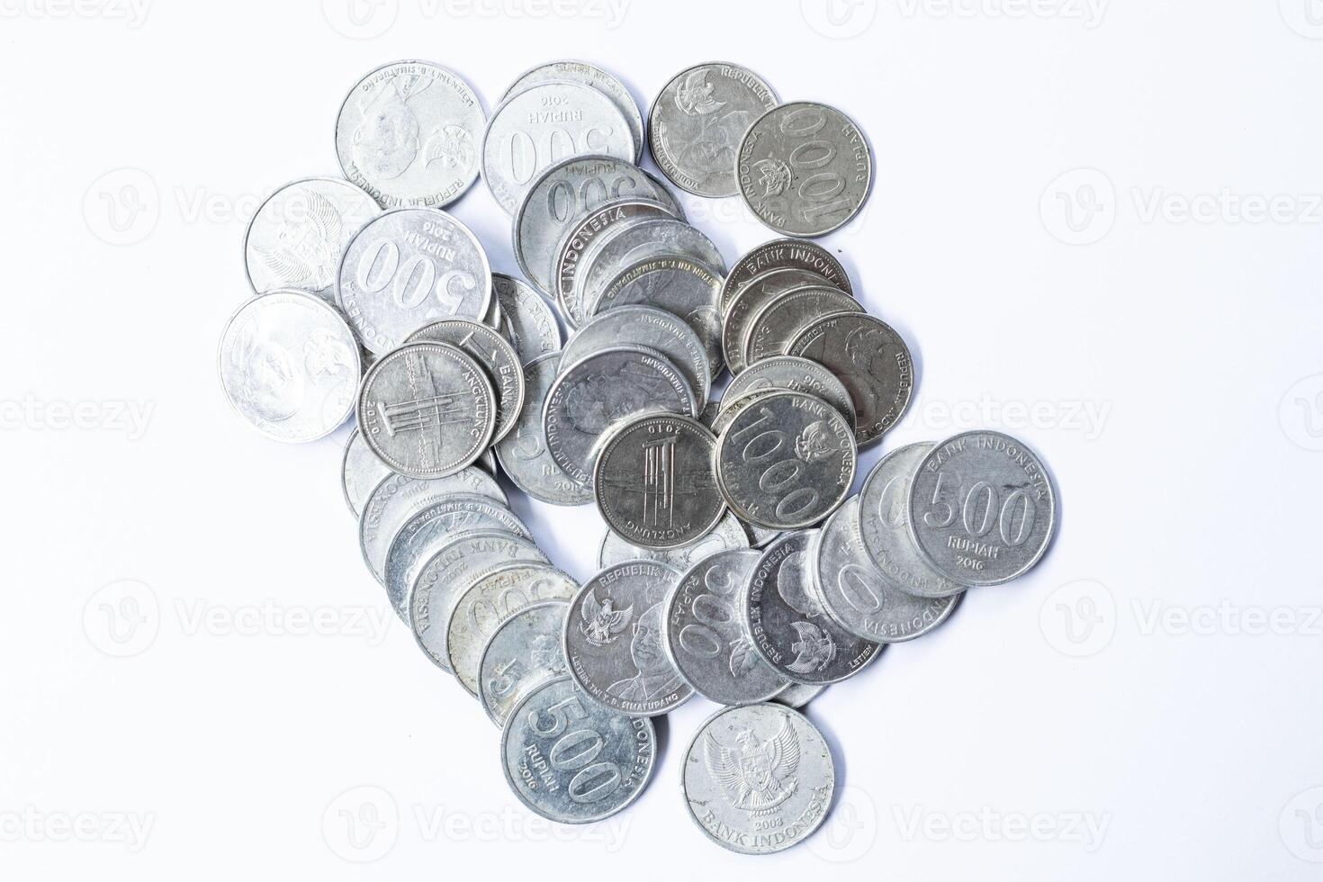 A stack of coins in isolation on a white background top view photo