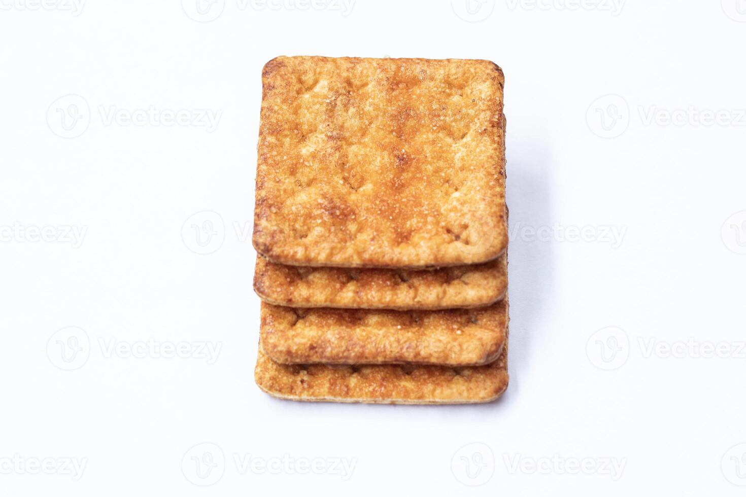 BISCUITS - A stack of delicious whole wheat biscuits with some crumbs isolated on white photo
