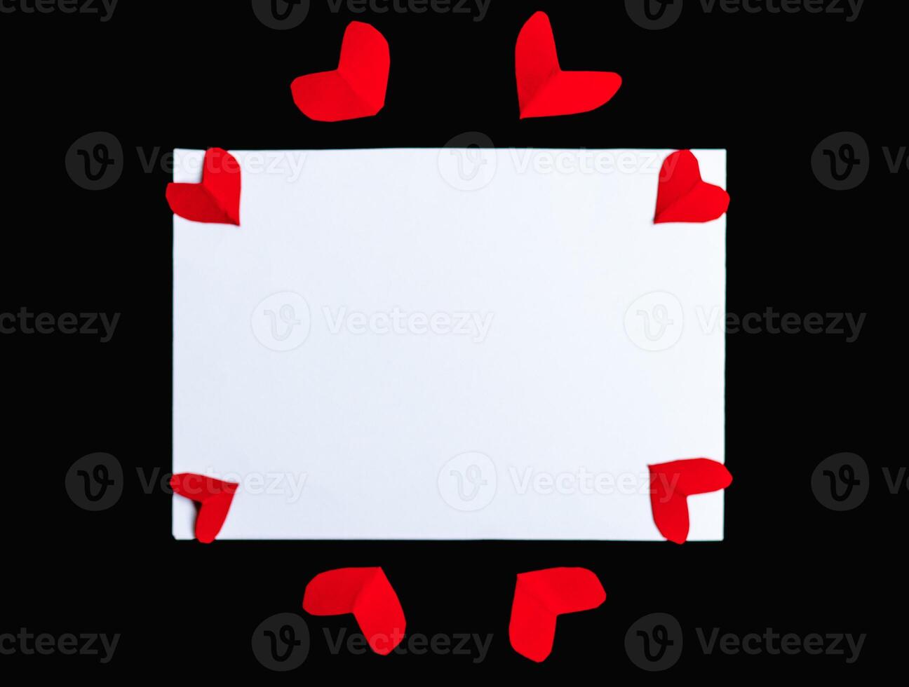 Blank red card with small heart ribbon top view with copy space photo