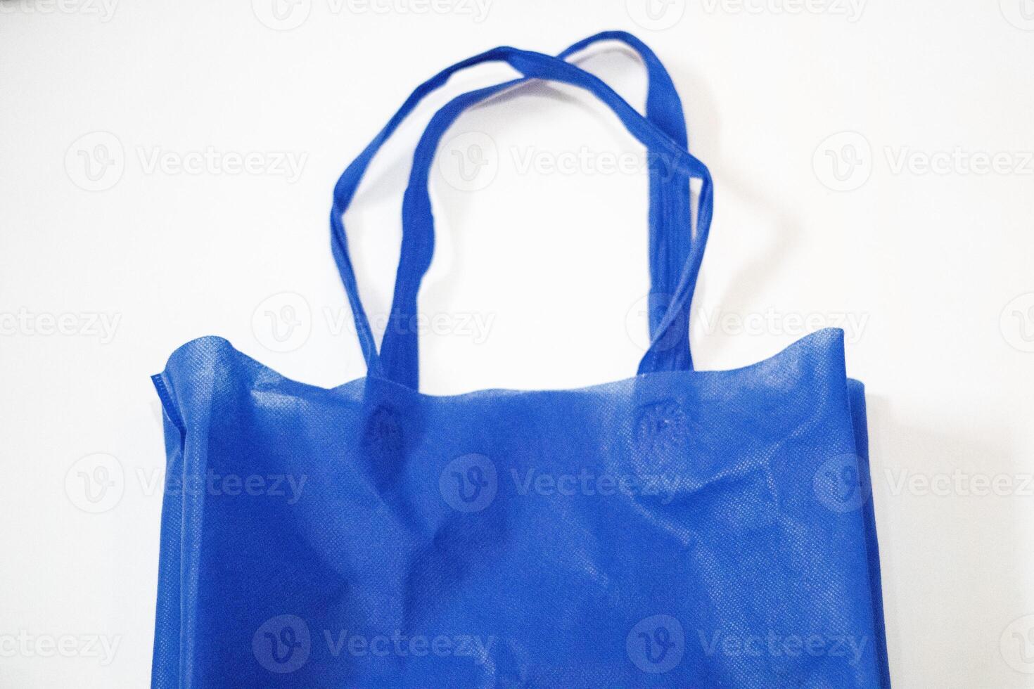 Fashion Canvas Tote Bag Blue Eco-Friendly Color Isolated on White Background. Reusable Bags for Groceries and Shopping. Design Template for Mock-up. Front look photo