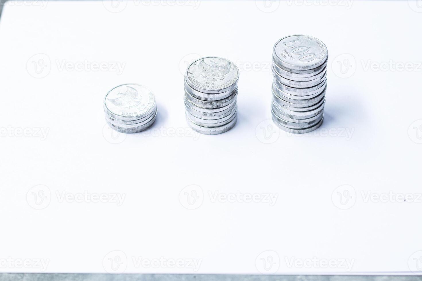 Pile of coins isolated on white background. photo