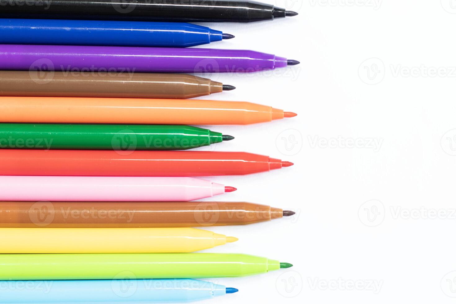 Colored markers isolated on white background photo
