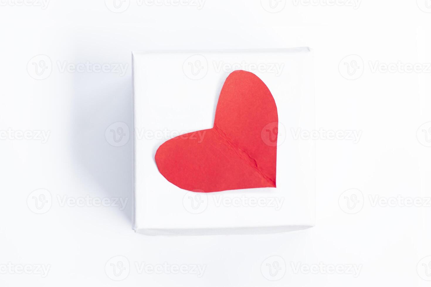 Concept of Valentine's day card, gift and paper cut red Heart. photo