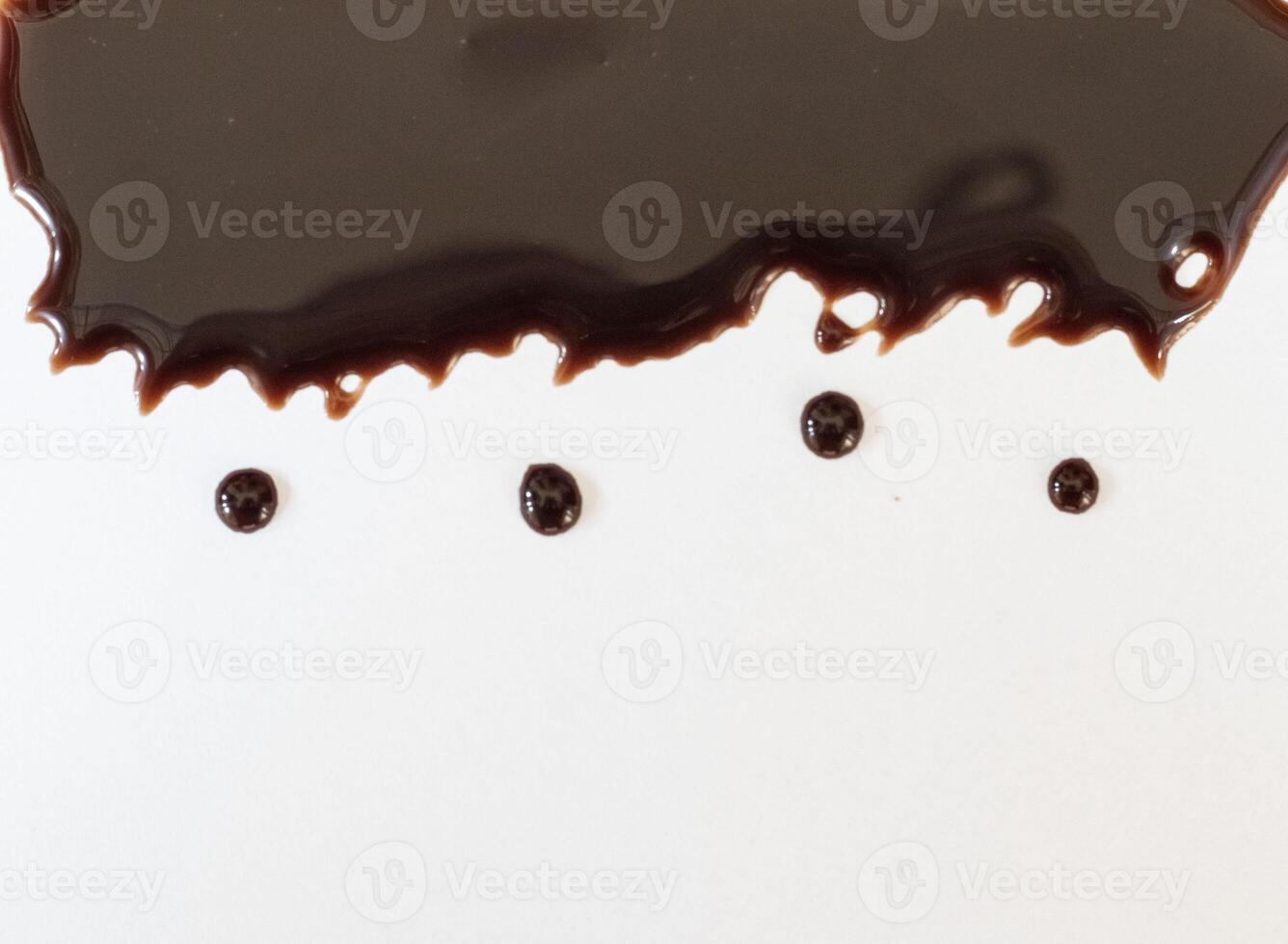 collection of various chocolate syrups leaking on white background. each shot separately photo