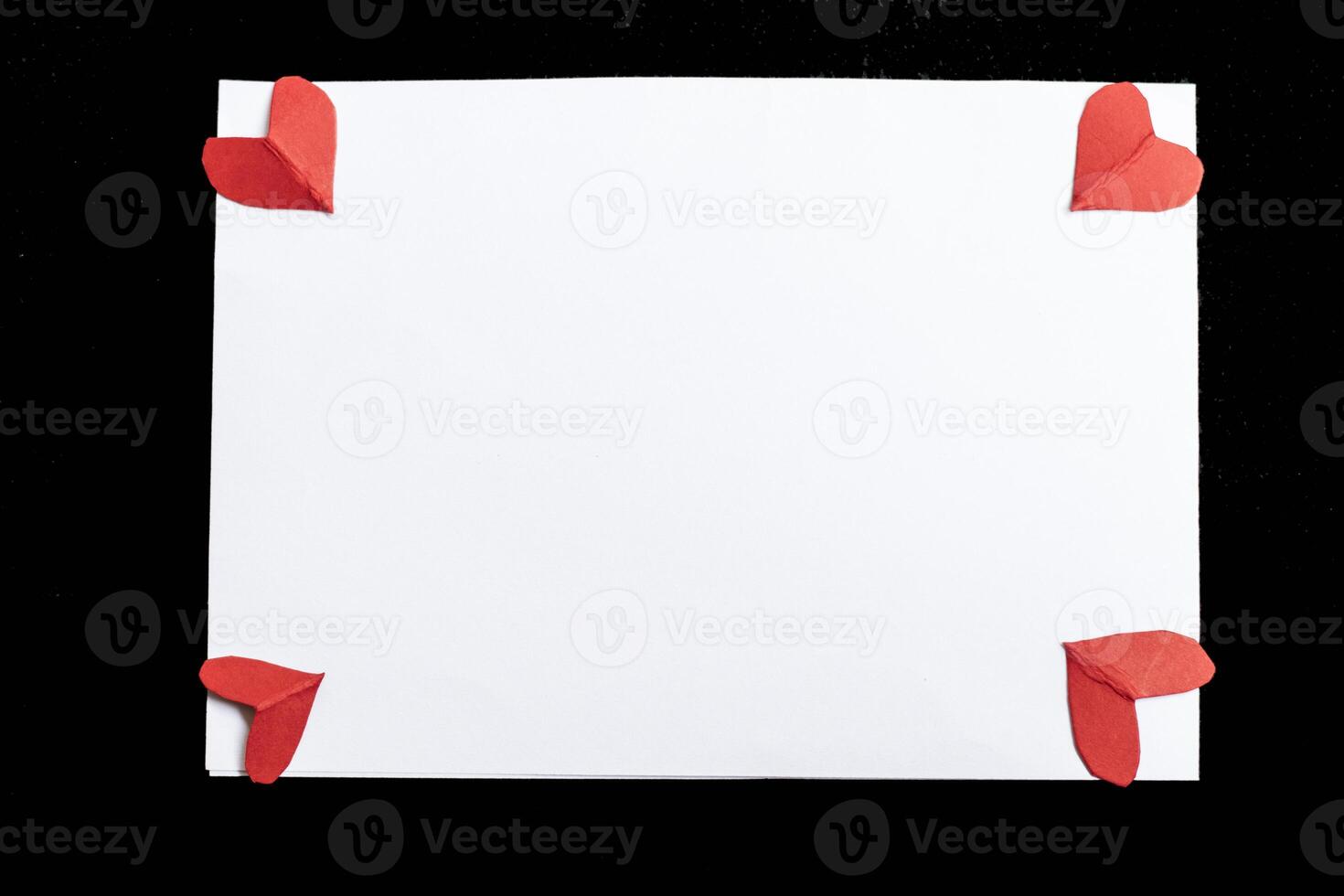 Valentine's Day card mockup with hearts on black background, top view, flat lay. Blank wedding invitation, flyer, greeting card with holiday decorations. Blank love letter with copy space photo