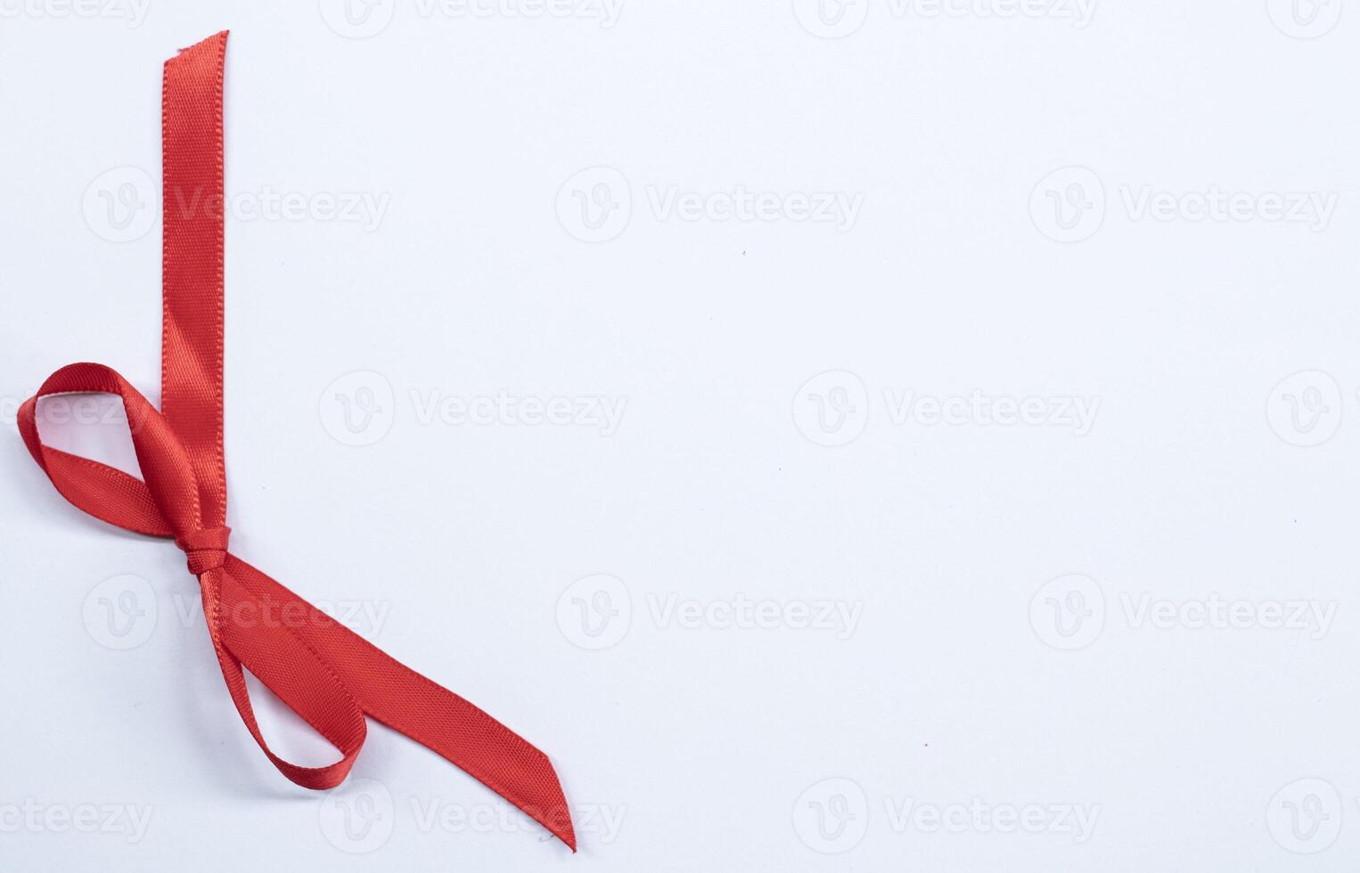 Red ribbon bow on white background. studio shooting photo