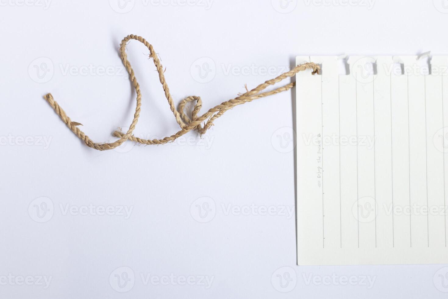 blank white note paper with thread photo