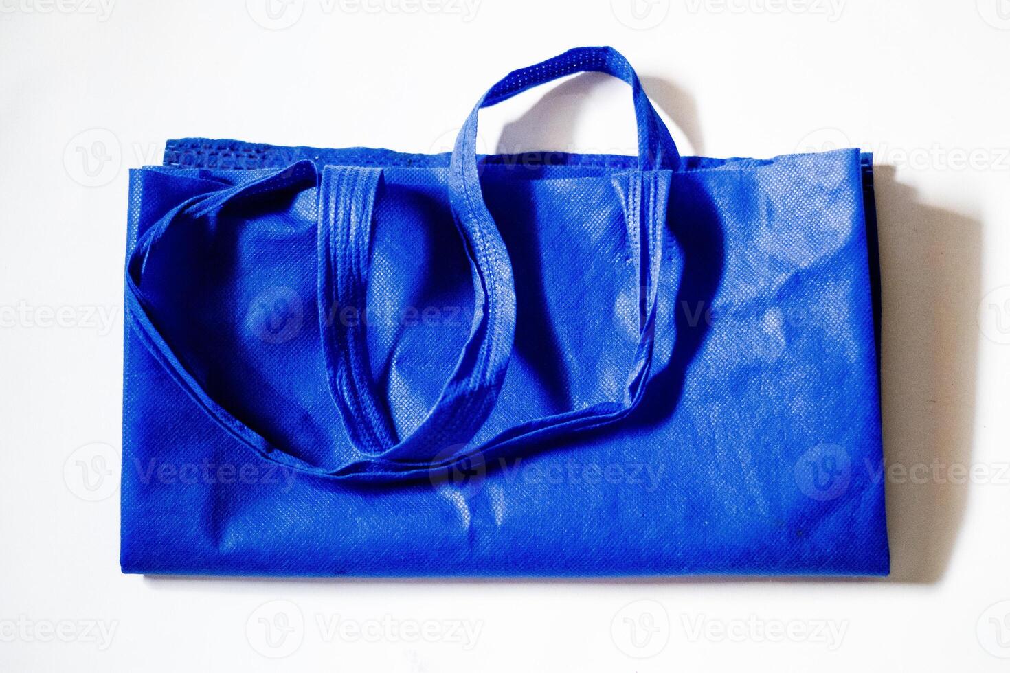 Fashion Canvas Tote Bag Blue Eco-Friendly Color Isolated on White Background. Reusable Bags for Groceries and Shopping. Design Template for Mock-up. Front look photo