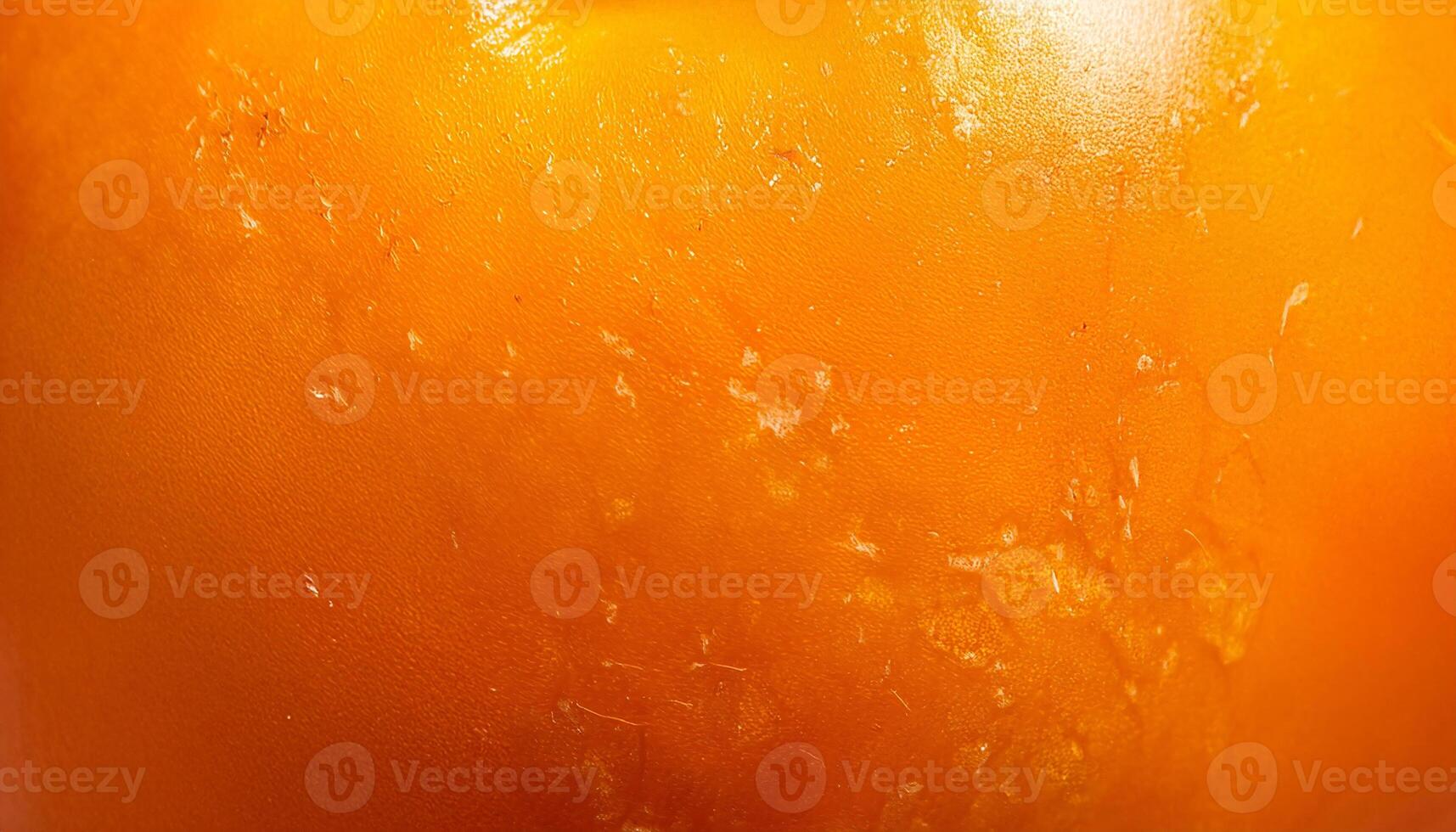Macro view of persimmon peel with smooth, glossy orange texture photo