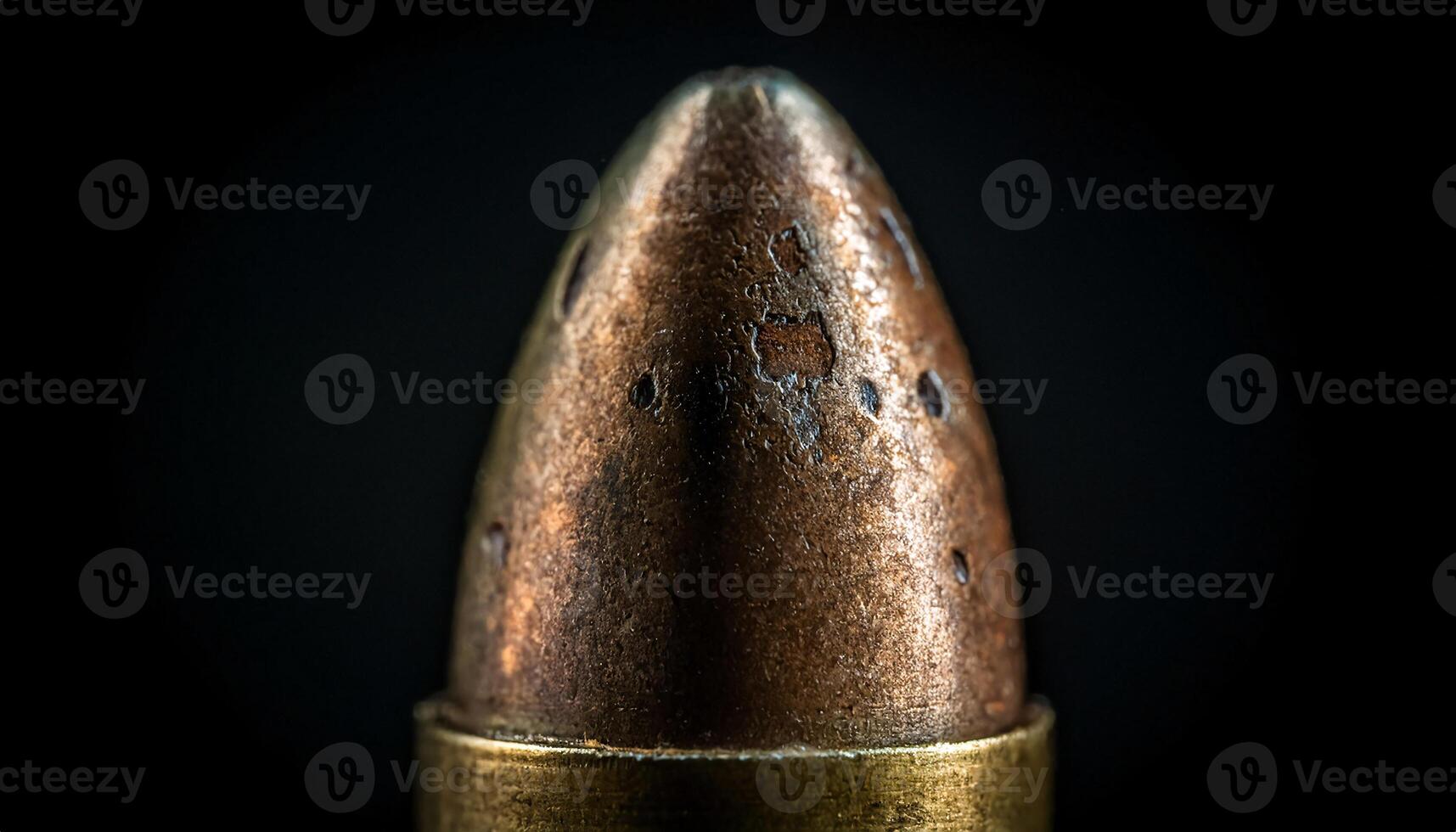 macro close-up of an aged bullet with visible corrosion and metallic texture against dark background photo