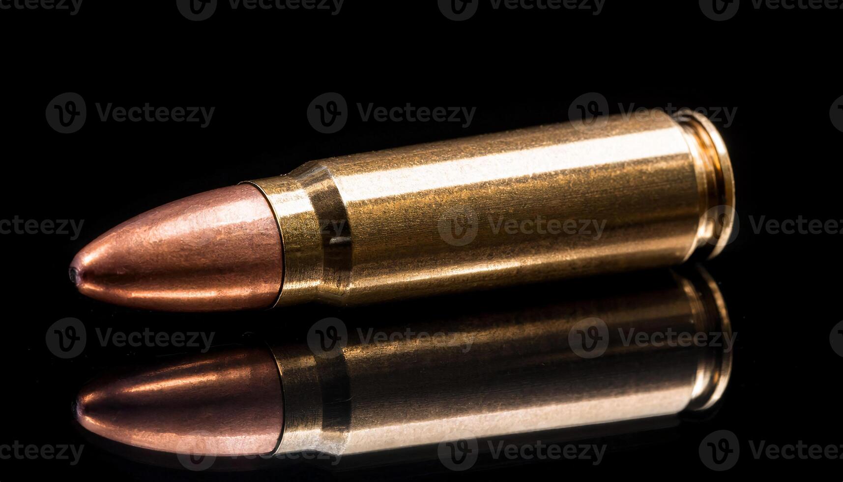 macro close-up of a single brass bullet casing with copper tip on reflective black surface and dramatic lighting photo