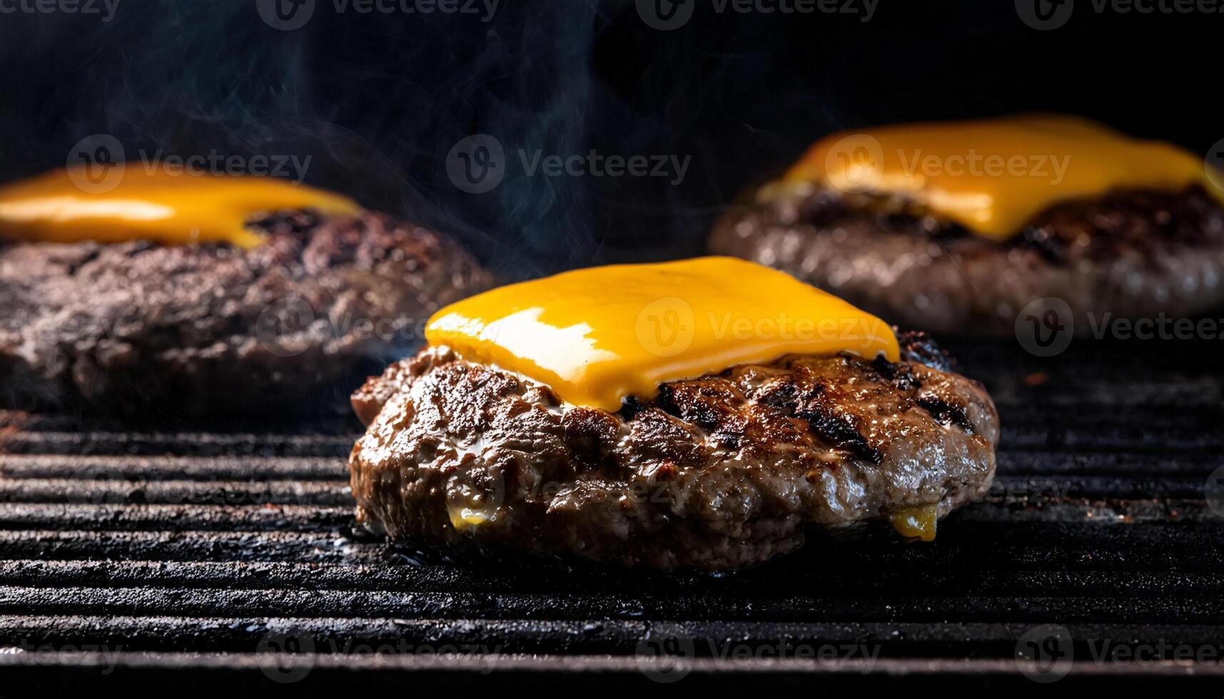 close-up of sizzling beef burger patties cooking on a hot grill, topped with melted cheddar cheese and smoke rising photo