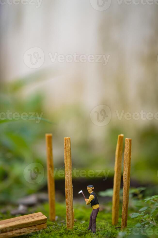 A diorama is a three-dimensional miniature depicting a particular scene or scene. A diorama depicting someone cutting wood. photo