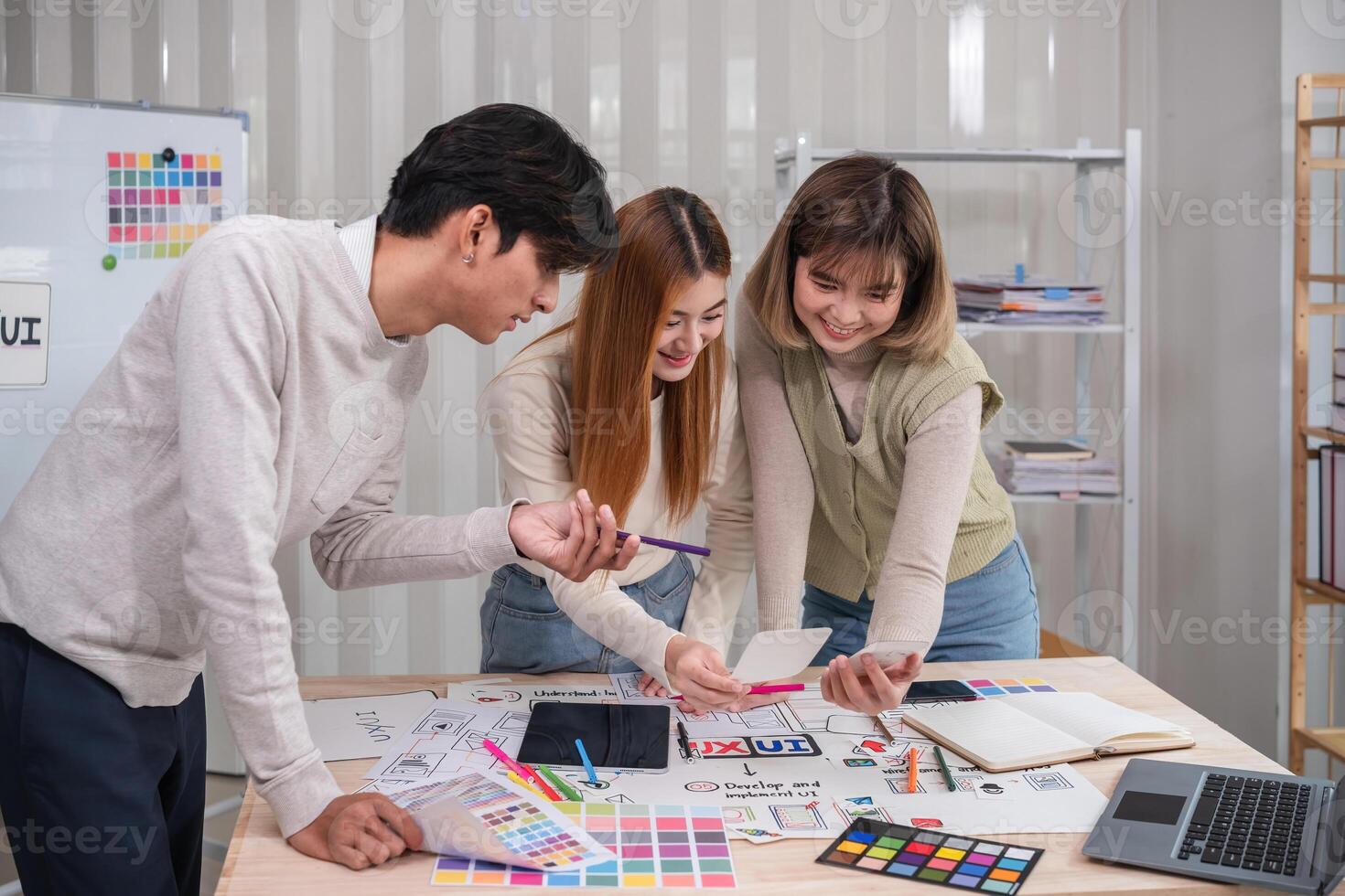 Application development team Brainstorming meeting and discussion to plan the design of ux ui and develop the system of applications on smartphones photo