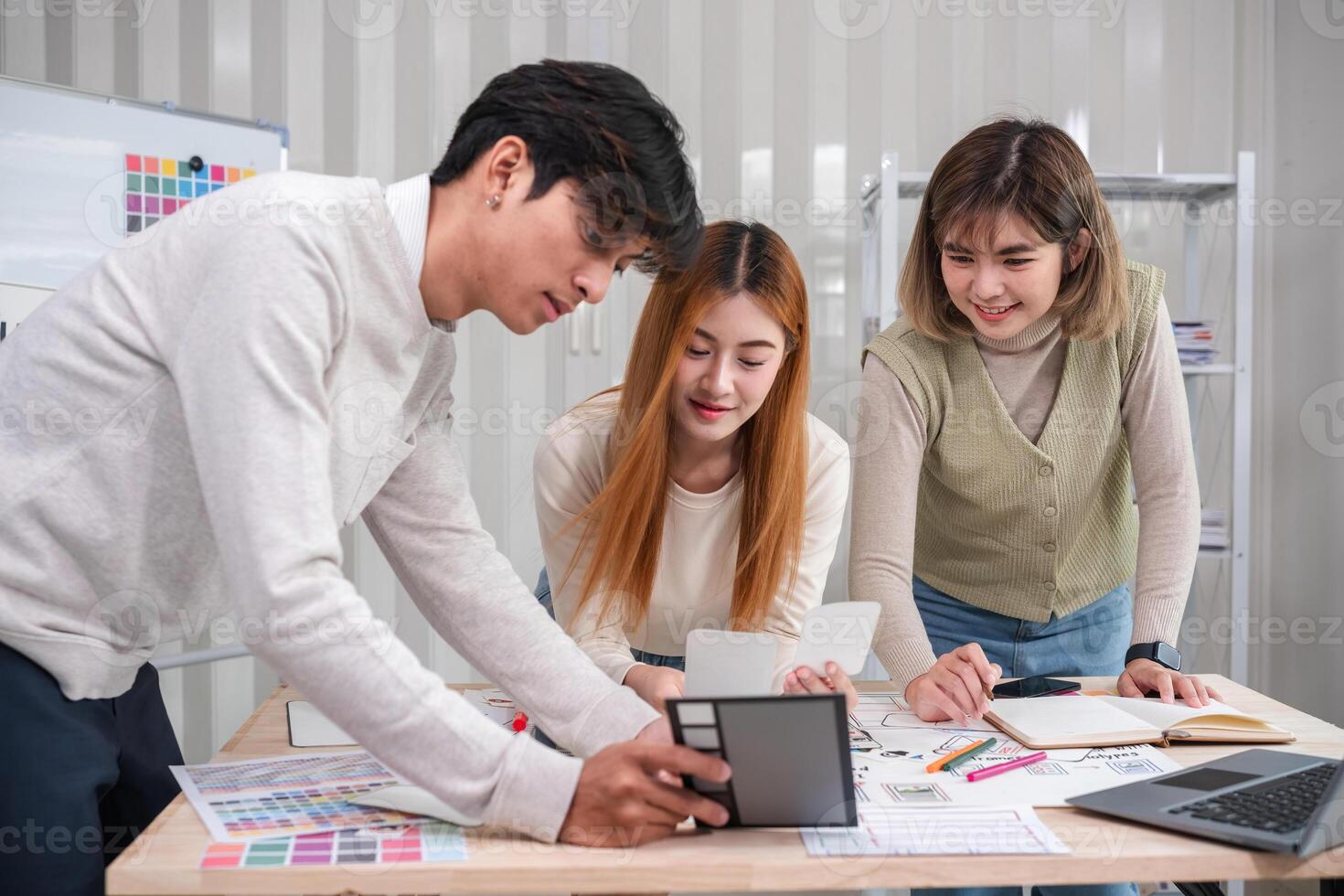 Application development team Brainstorming meeting and discussion to plan the design of ux ui and develop the system of applications on smartphones photo