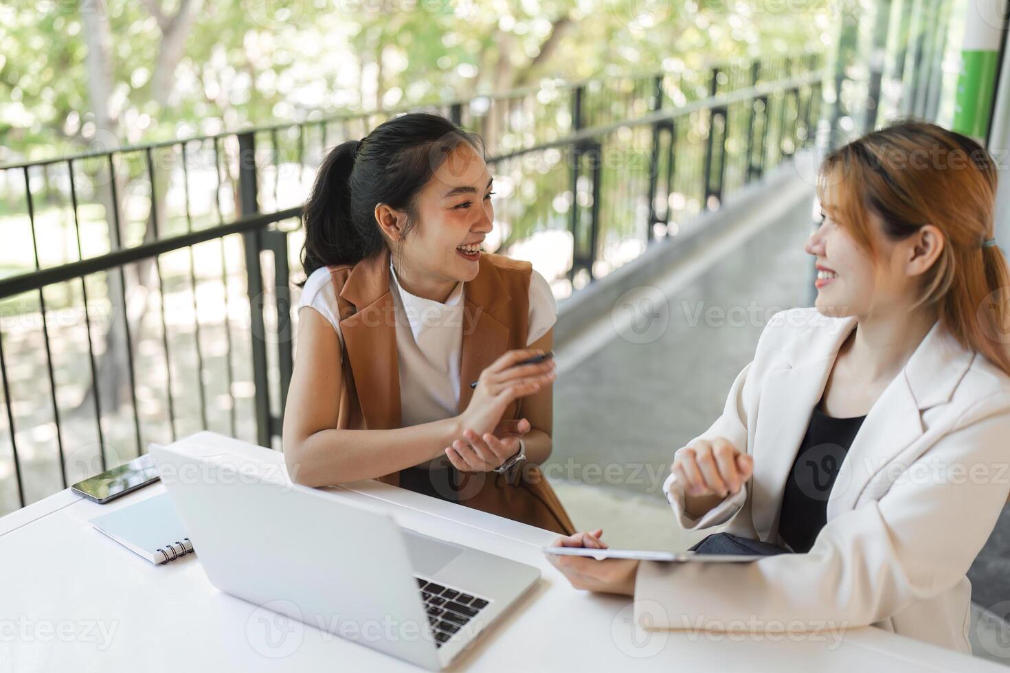 Accounting Team Collaborating in Modern Office Environment with Laptops and Documents photo