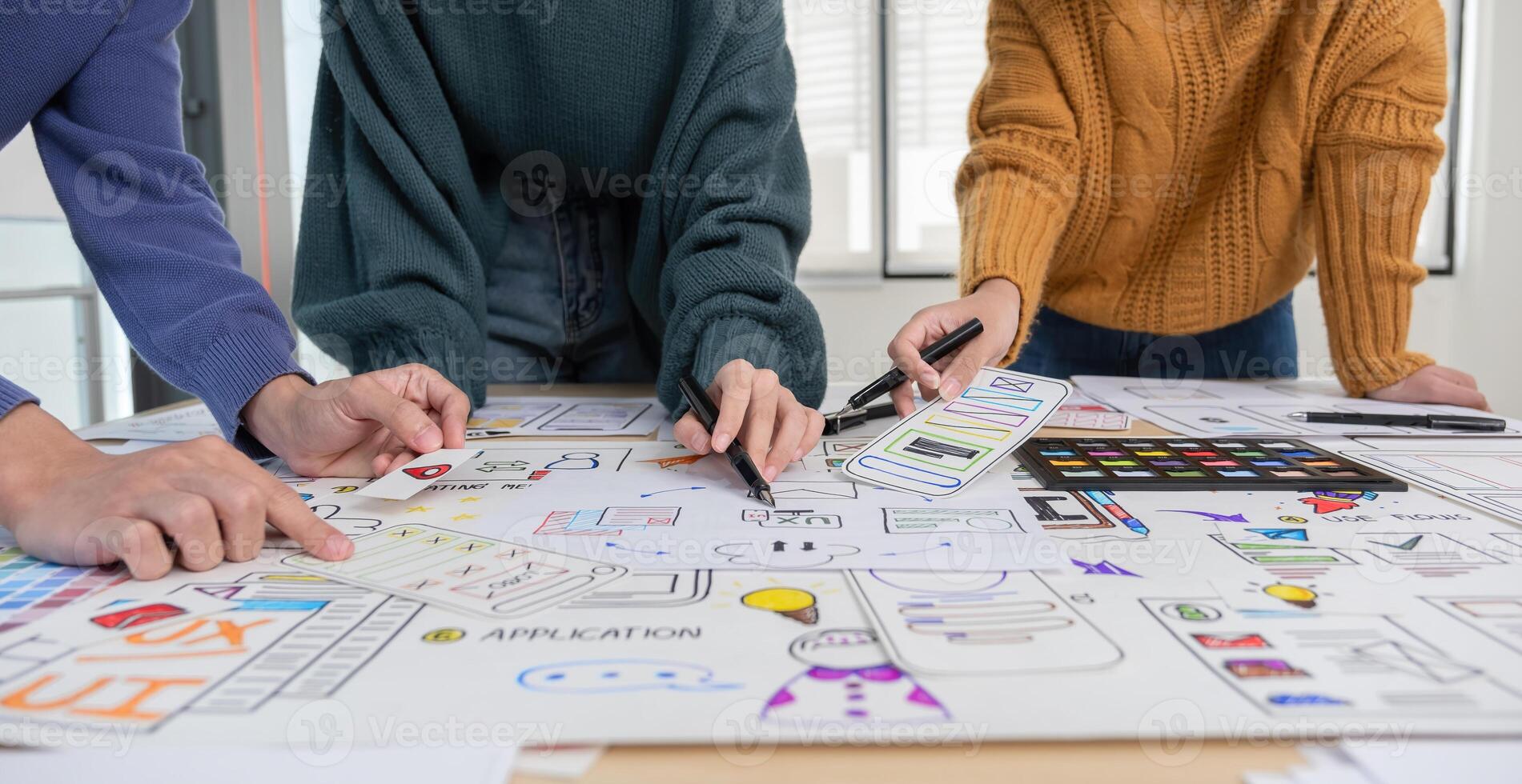 Application development team Brainstorming meeting and discussion to plan the design of ux ui and develop the system of applications on smartphones photo