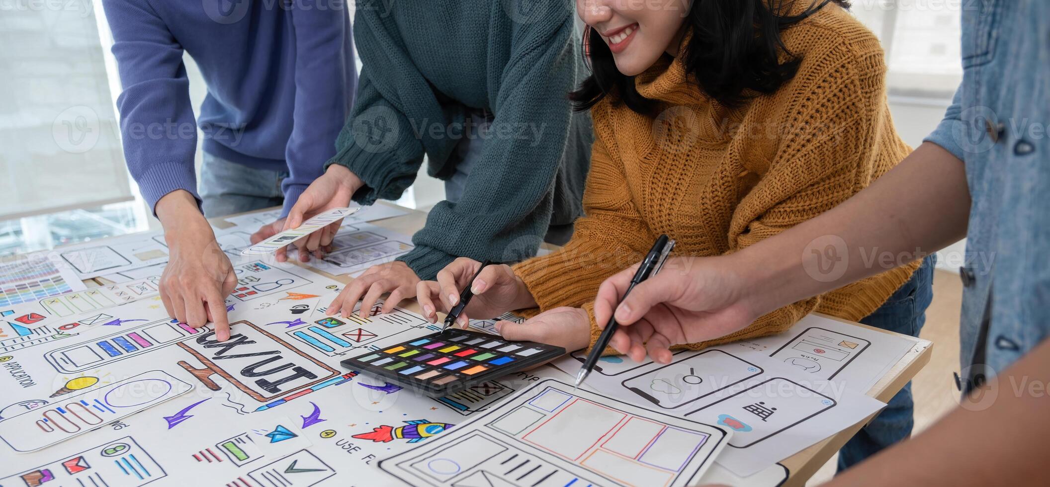 Application development team Brainstorming meeting and discussion to plan the design of ux ui and develop the system of applications on smartphones photo