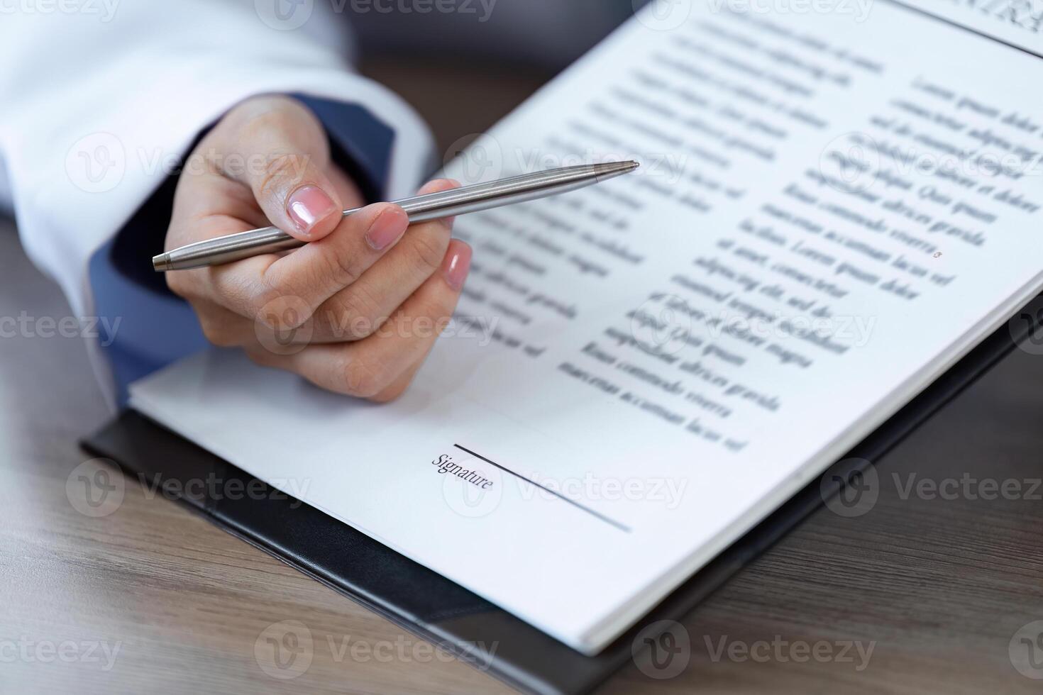 Doctor Advises Patient to Sign Important Medical Documents for Health and Treatment Authorization in a Clinical Setting photo
