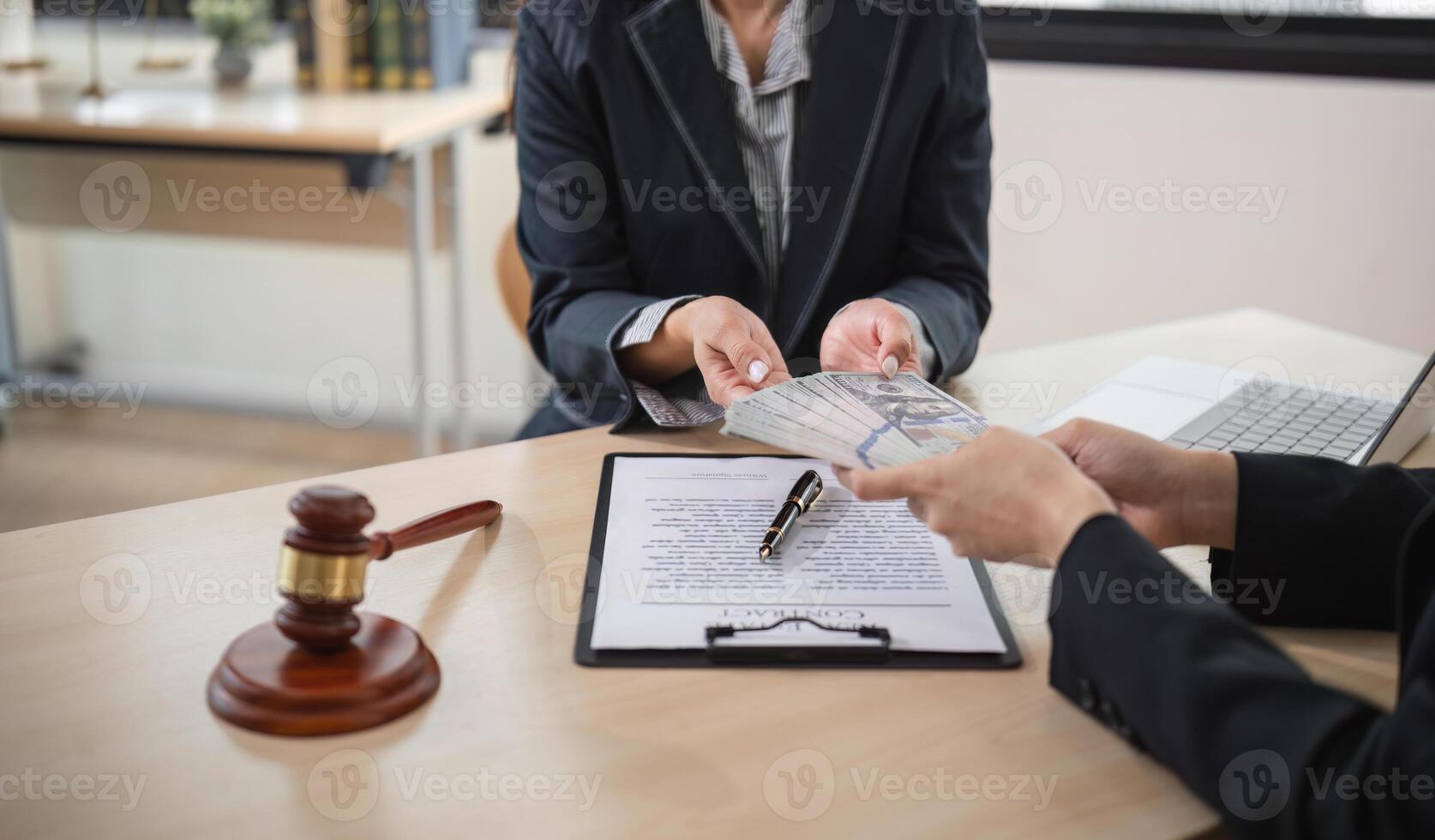Corruption Lawyer Accepting Bribe Money in Office with Legal Documents and Gavel on Desk photo