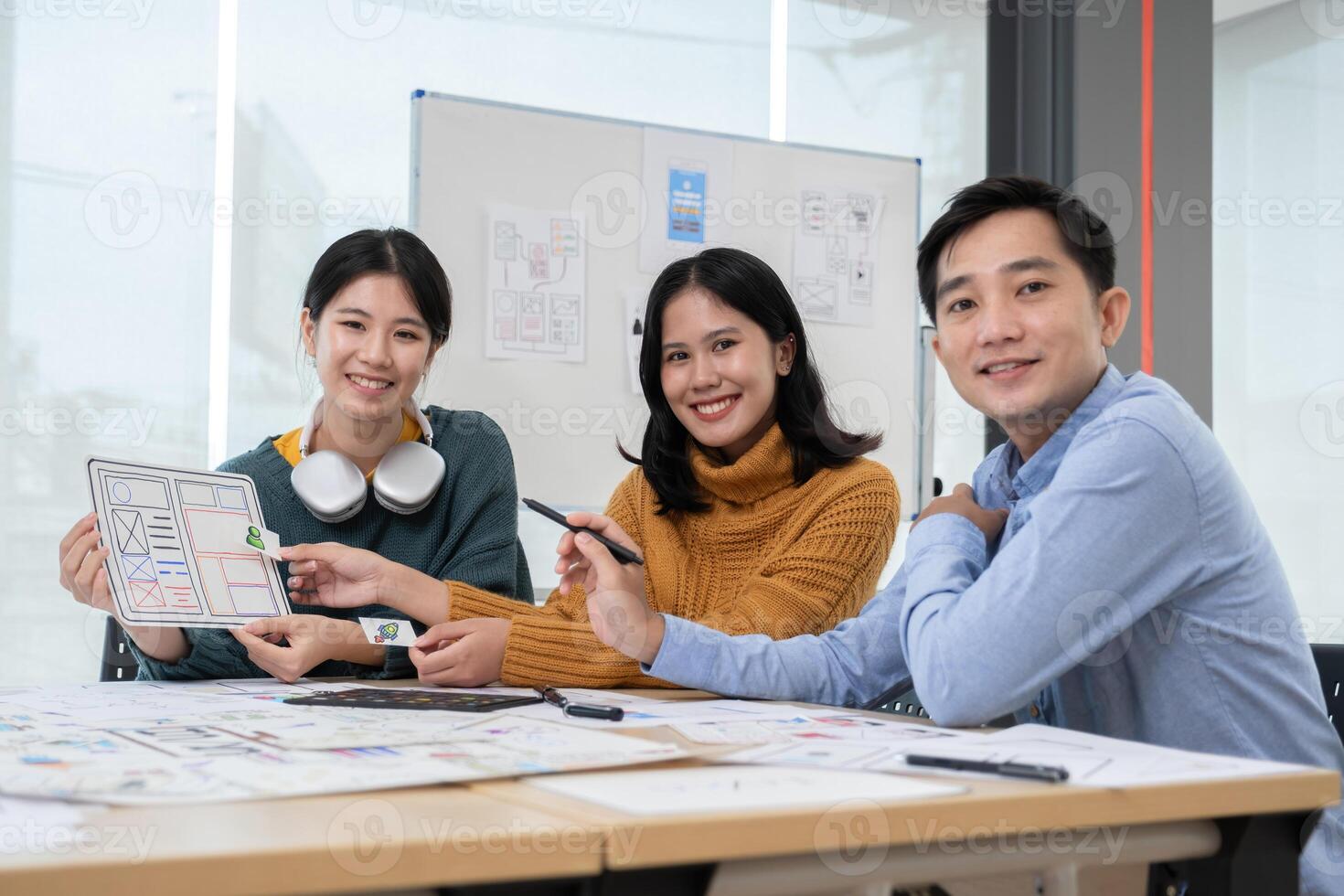 Application development team Brainstorming meeting and discussion to plan the design of ux ui and develop the system of applications on smartphones photo