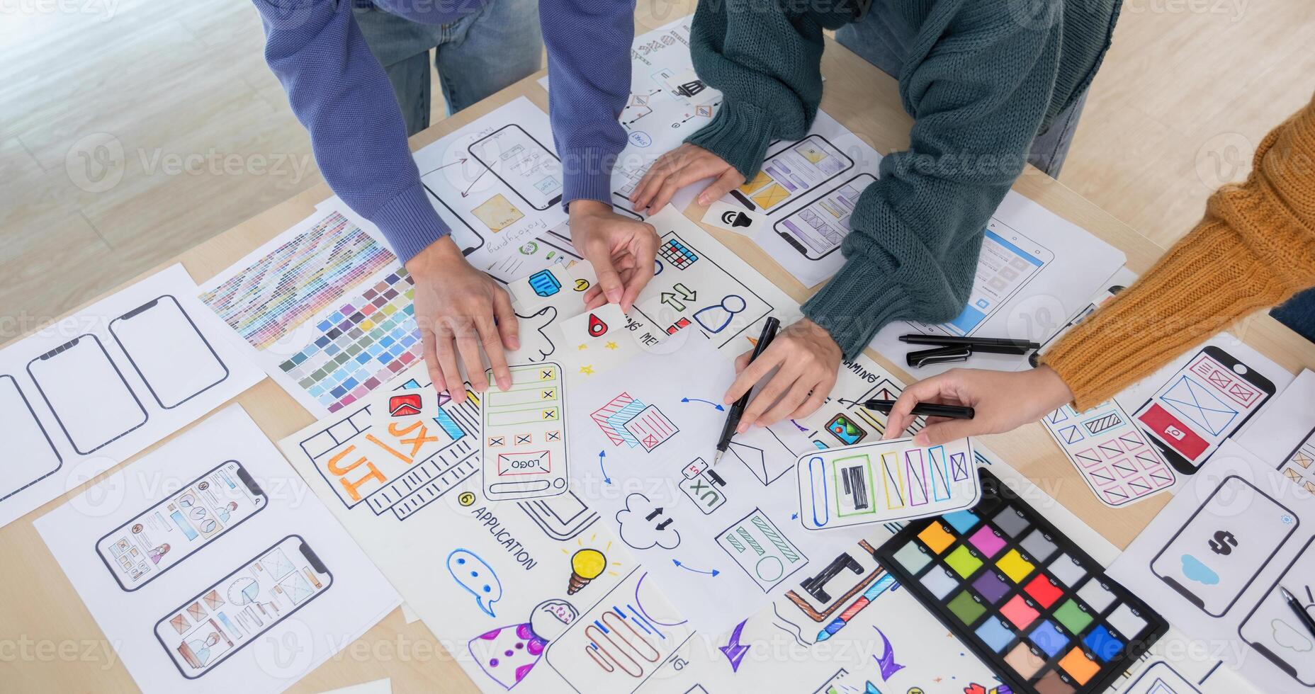 Application development team Brainstorming meeting and discussion to plan the design of ux ui and develop the system of applications on smartphones photo