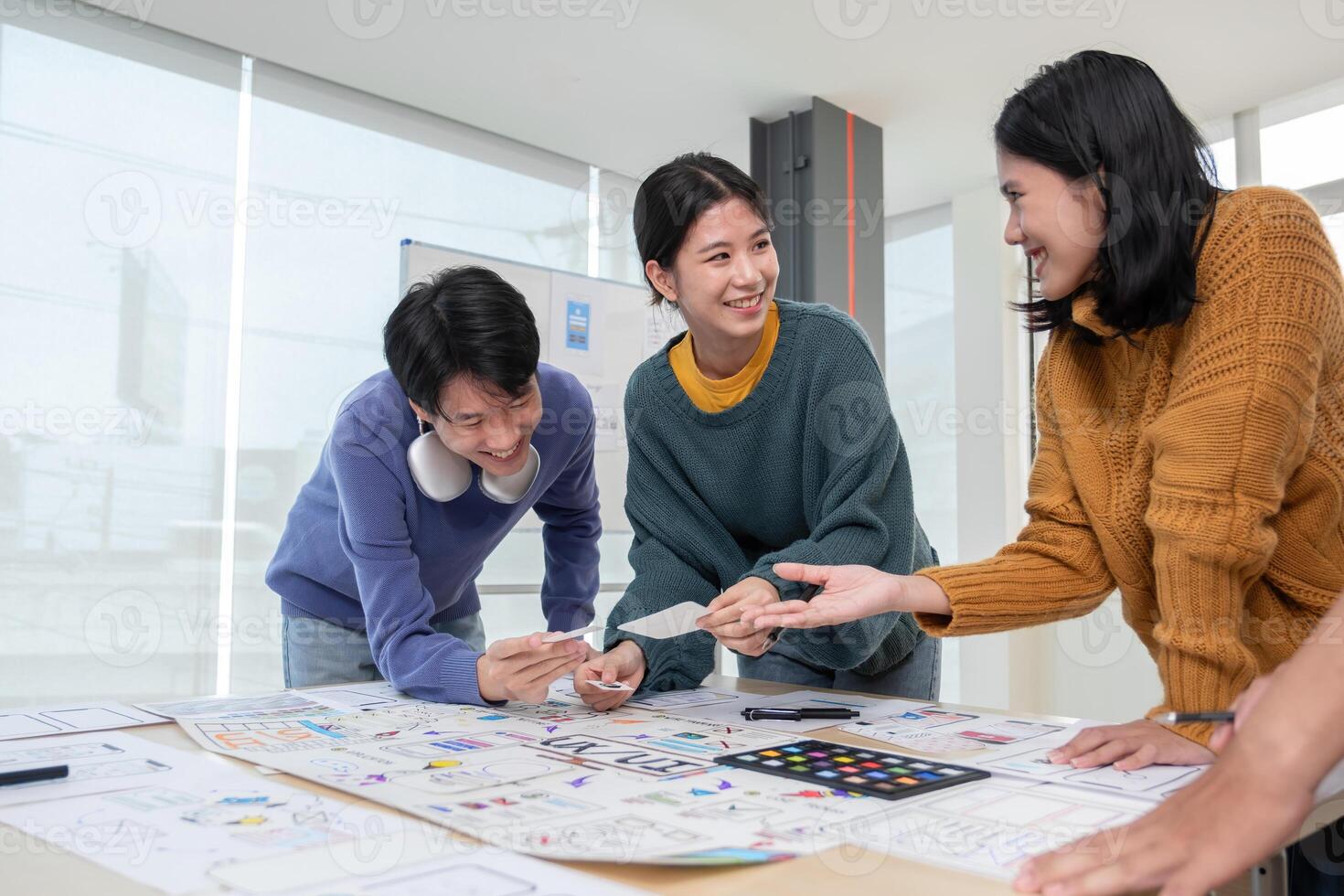 Application development team Brainstorming meeting and discussion to plan the design of ux ui and develop the system of applications on smartphones photo