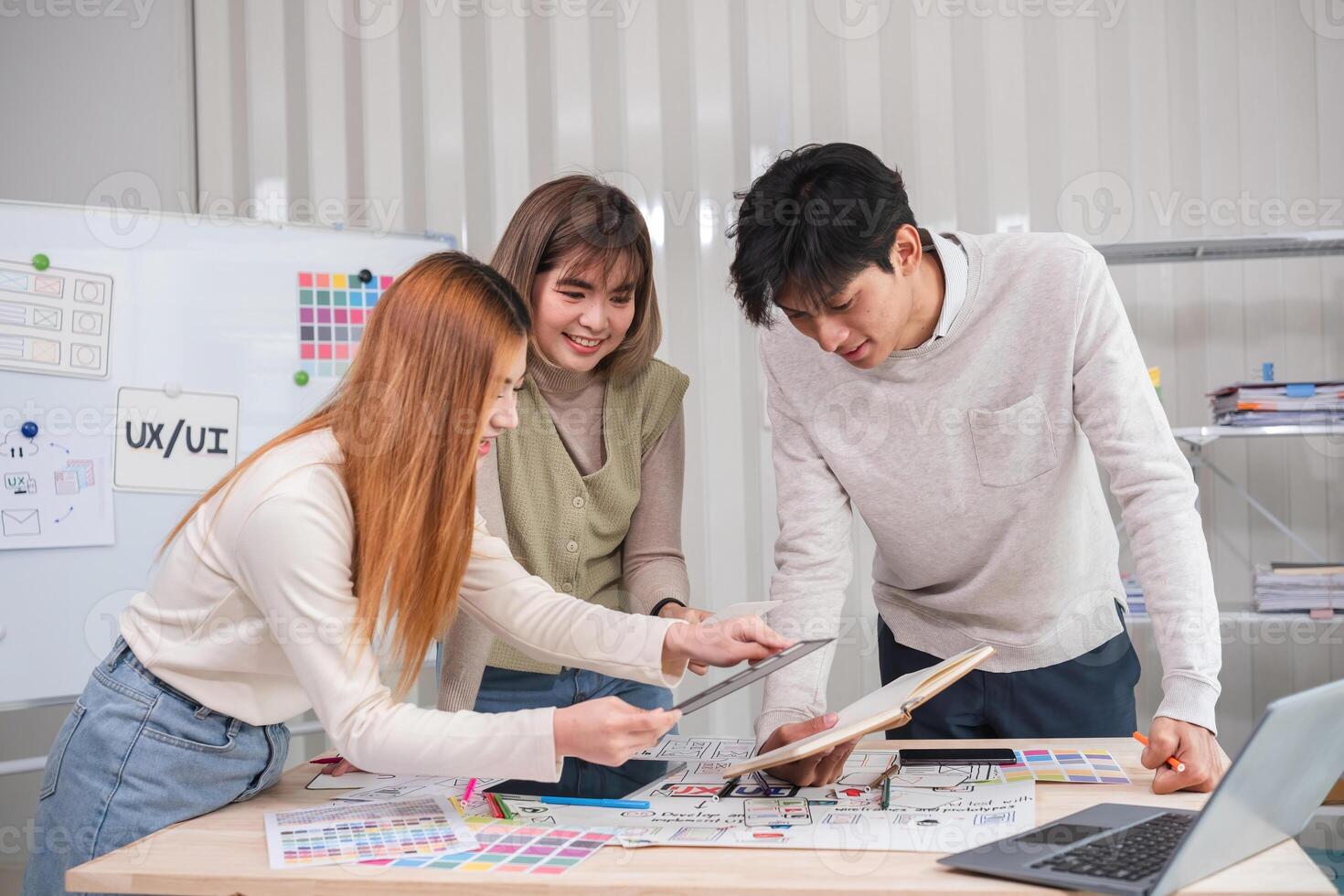 Application development team Brainstorming meeting and discussion to plan the design of ux ui and develop the system of applications on smartphones photo