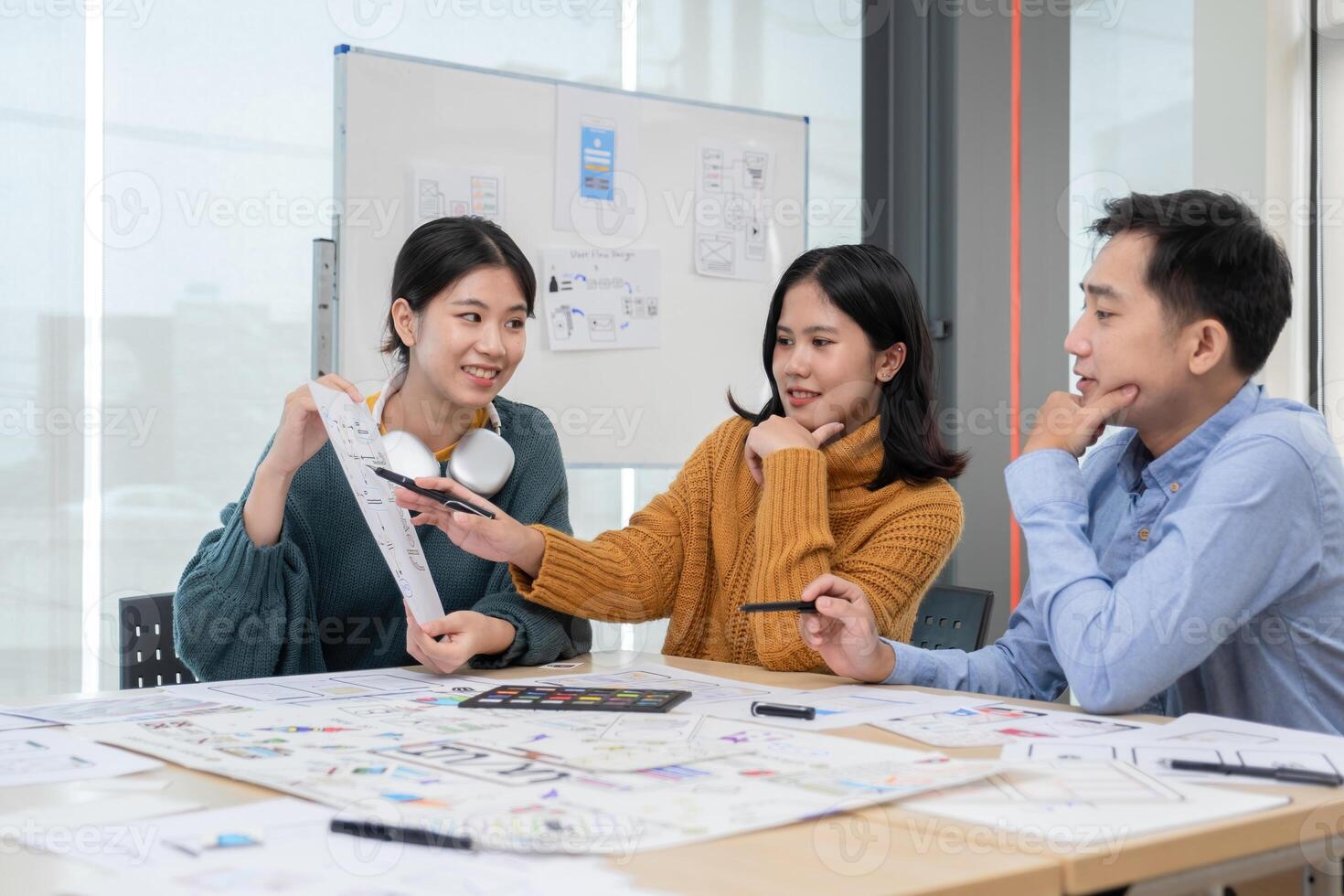 Application development team Brainstorming meeting and discussion to plan the design of ux ui and develop the system of applications on smartphones photo
