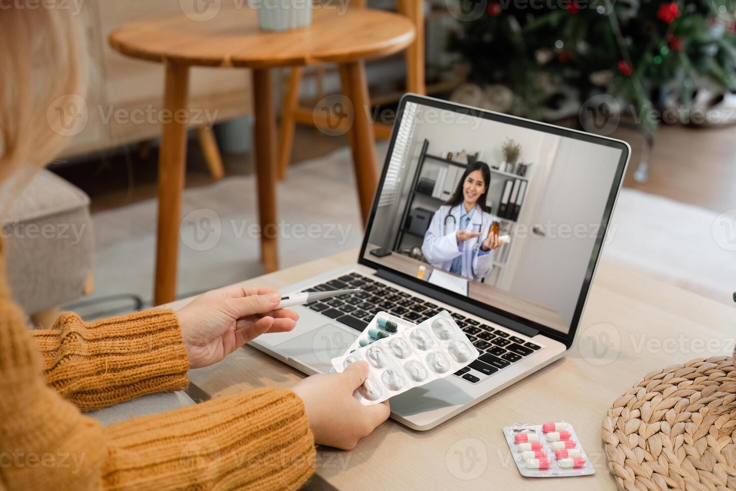 Female Doctor Provides Online Health Advice via Call on Laptop in Modern Home Setting photo