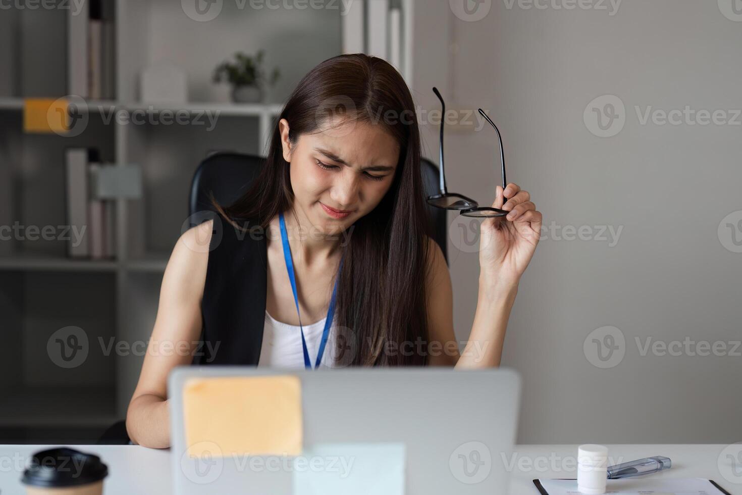Stressed Office Workers Struggling with Workload and Deadlines in a Modern Corporate Environment photo
