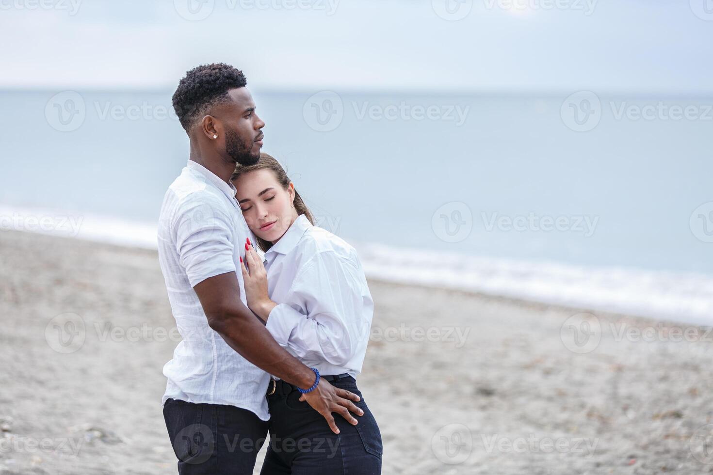 Couple enjoying a romantic moment together at Zapillo Beach in Almeria, Spain, on a serene afternoon by the sea photo