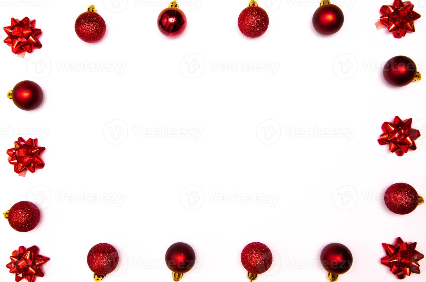 Top view photo christmas tree toys of red colour on white background for greeting card. Xmas backdrop with space for text.Copyspace.