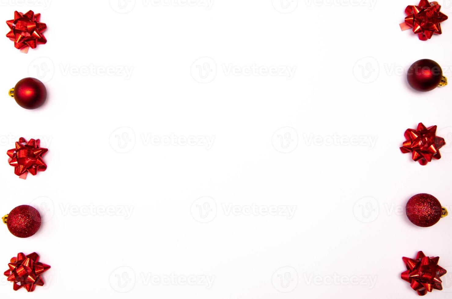 Top view photo christmas tree toys of red colour on white background for greeting card. Xmas backdrop with space for text.Copyspace.