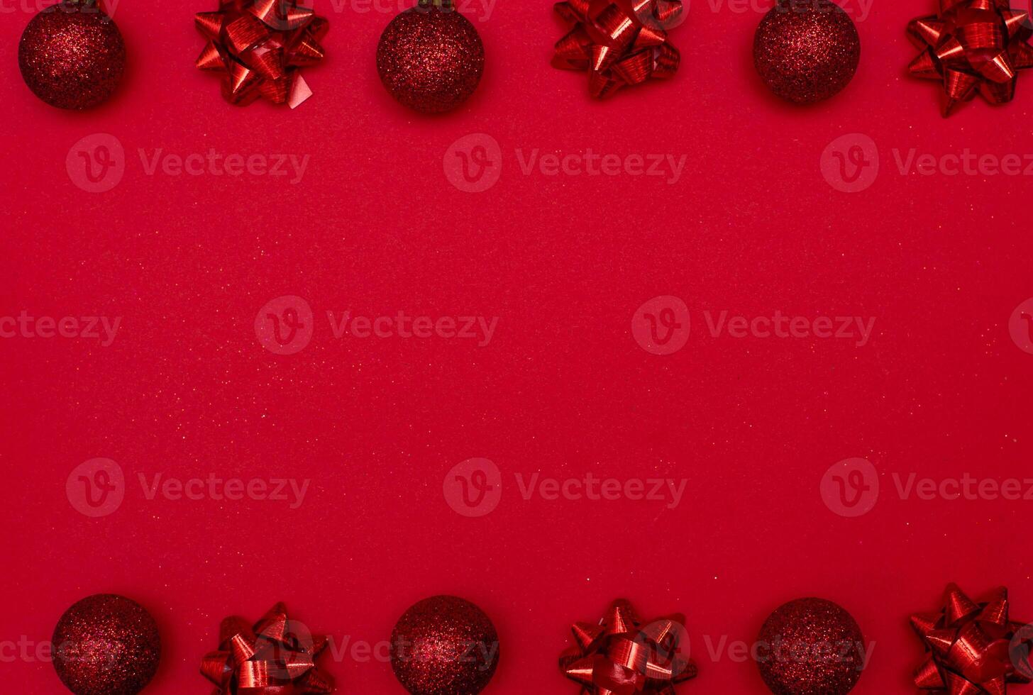 Top view photo christmas tree toys of red colour on white background for greeting card. Xmas backdrop with space for text.Copyspace.