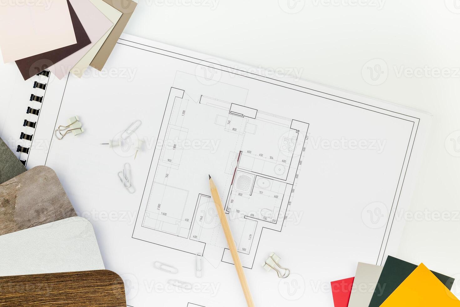 Interior designer table workplace with house plan photo