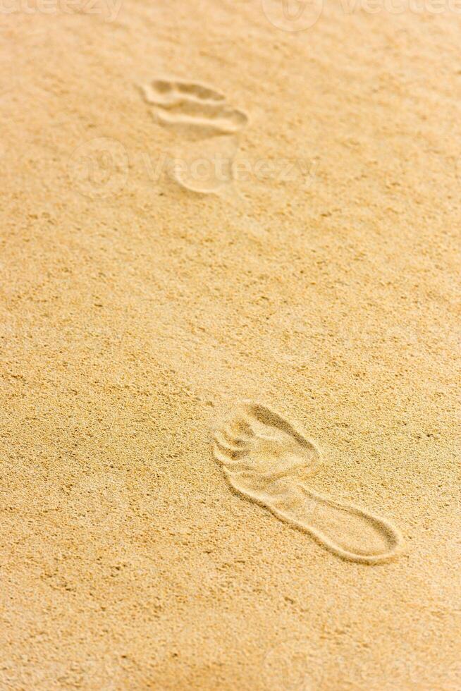 Human footprints on the sand photo
