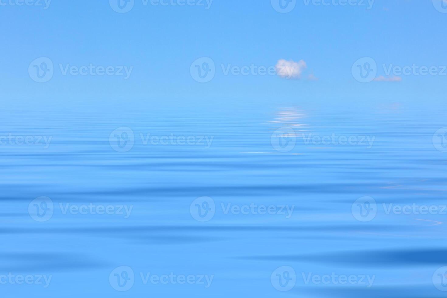Water background with reflections of bright sky photo