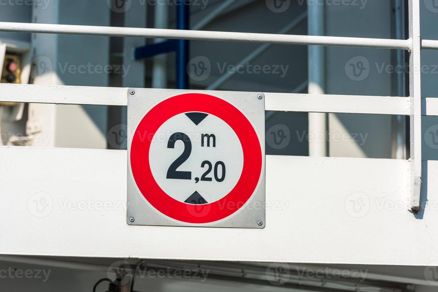 Sign of height restriction at the entrance to the ferryboat photo