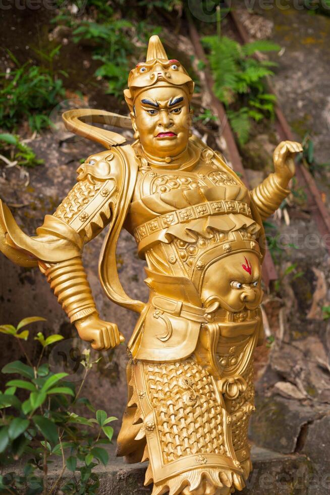 Golden statue in The monastery in Hong Kong photo
