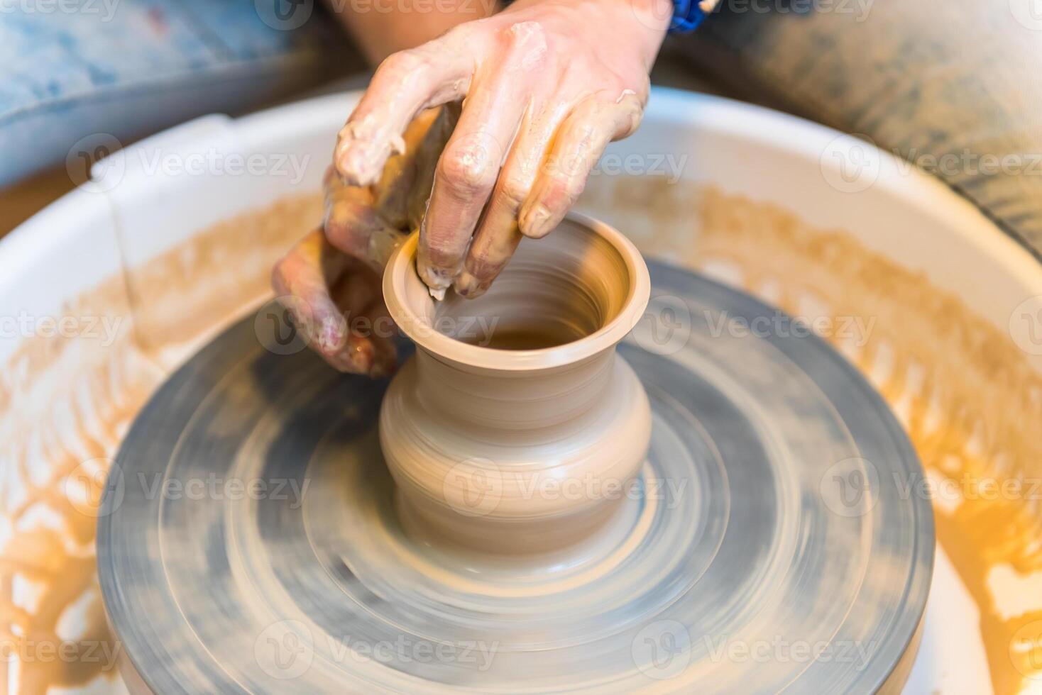 Pottering - creating a clay cup in process photo