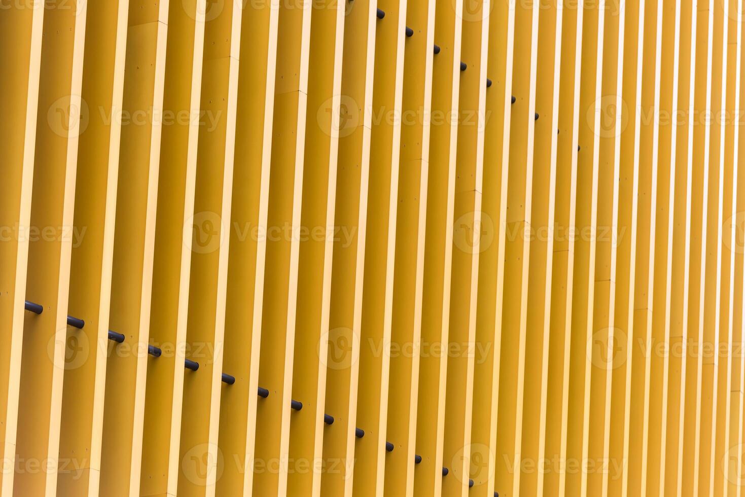 Detail of yellow metal building facade photo
