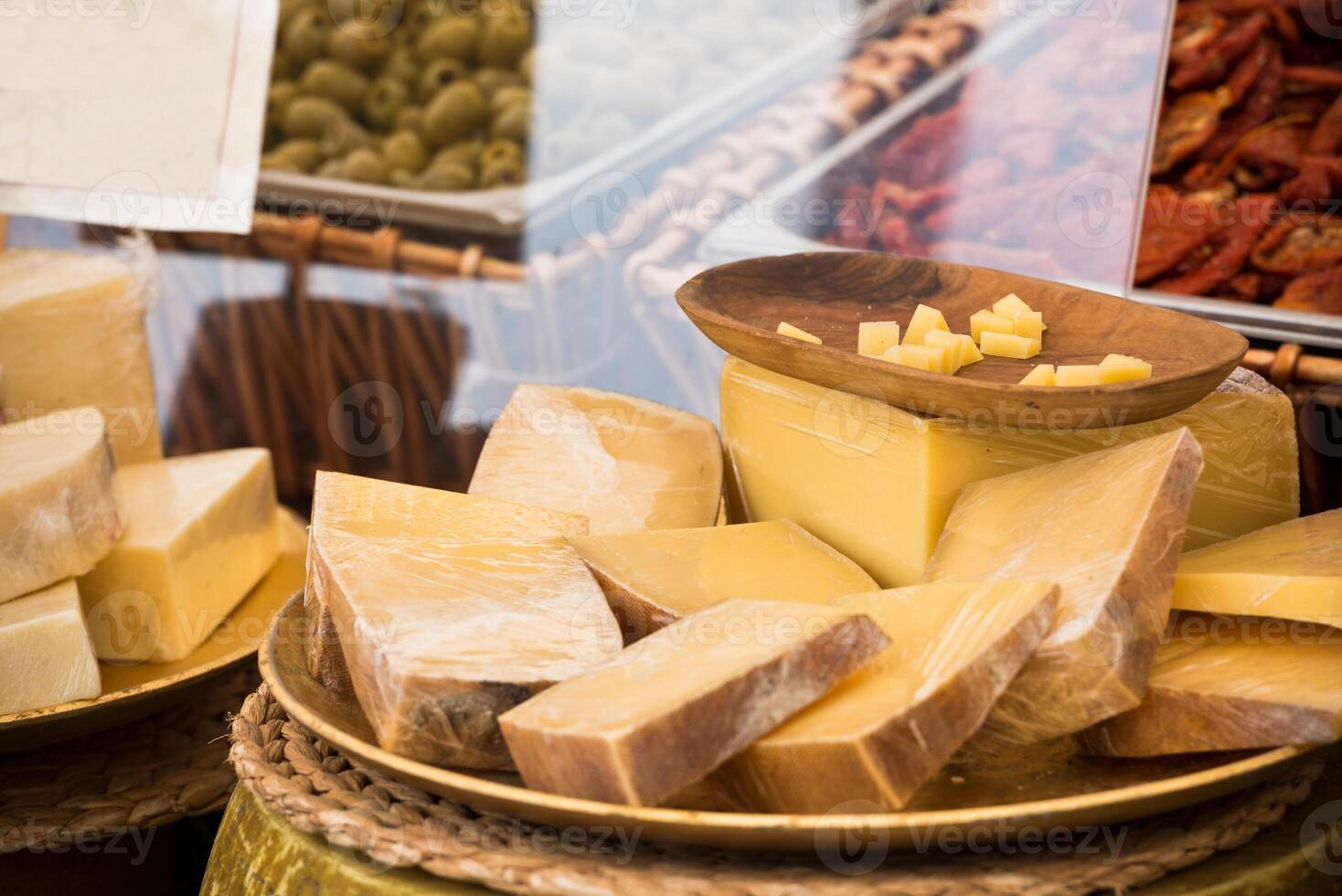 Chunks of different cheeses at a local european market photo