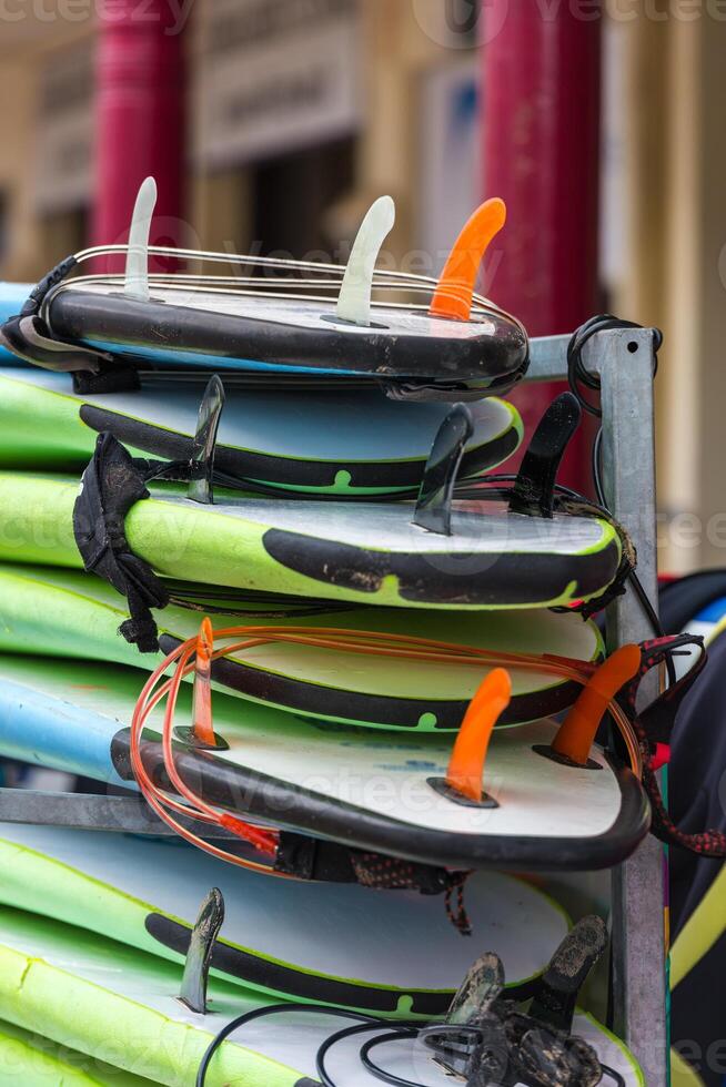 Surf boards in a stack photo
