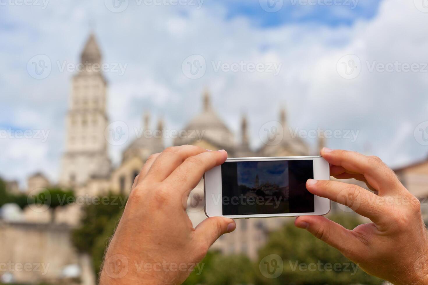 Tourist taking photo of Perigueux, France