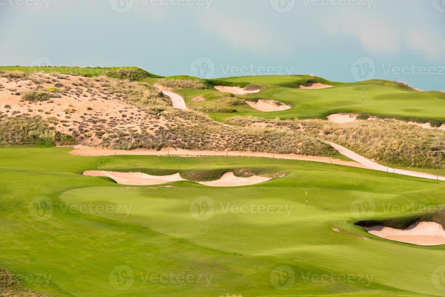 golf resort with the scenery of the sea photo