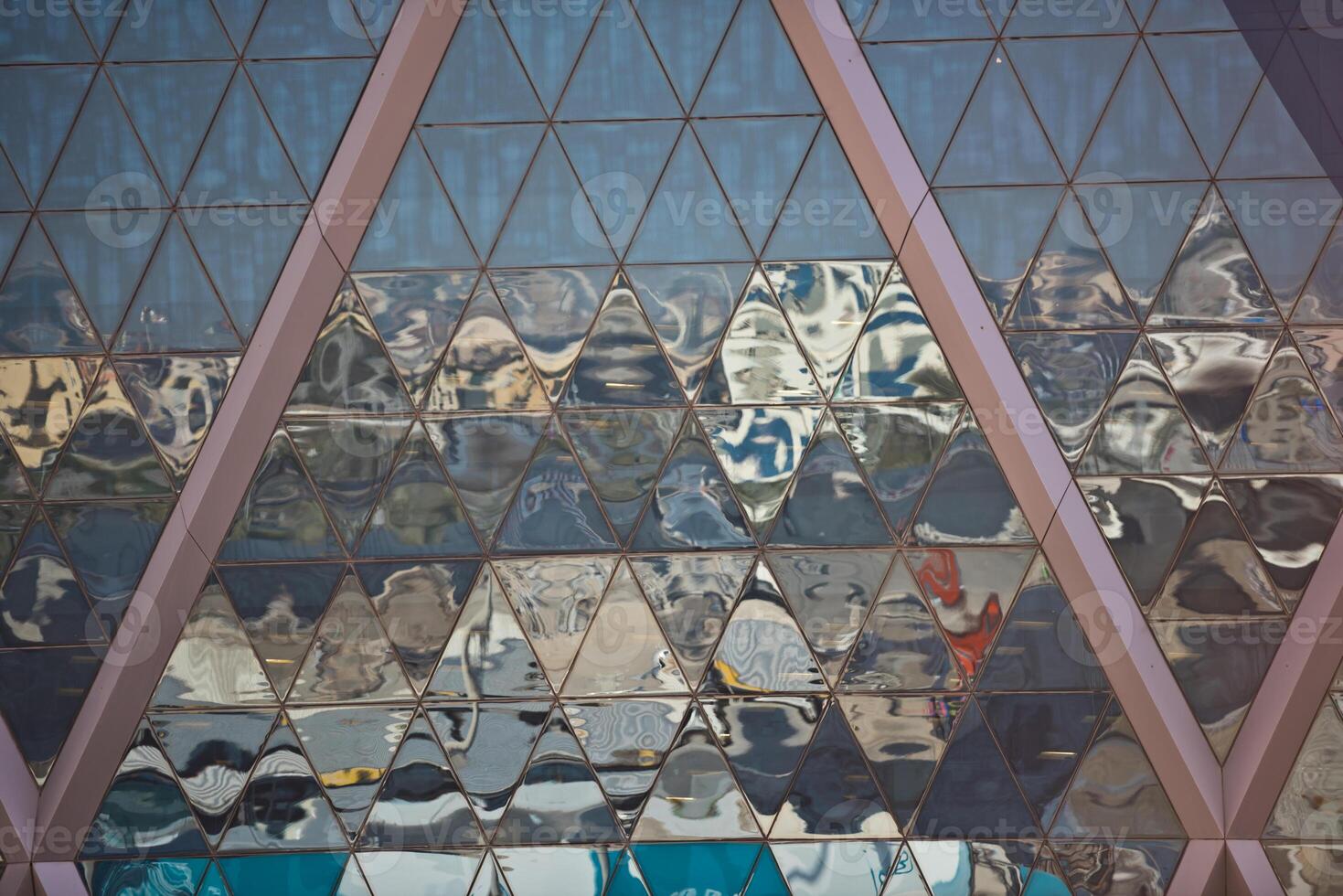 City reflections in a skyscraper mirror glass facade photo