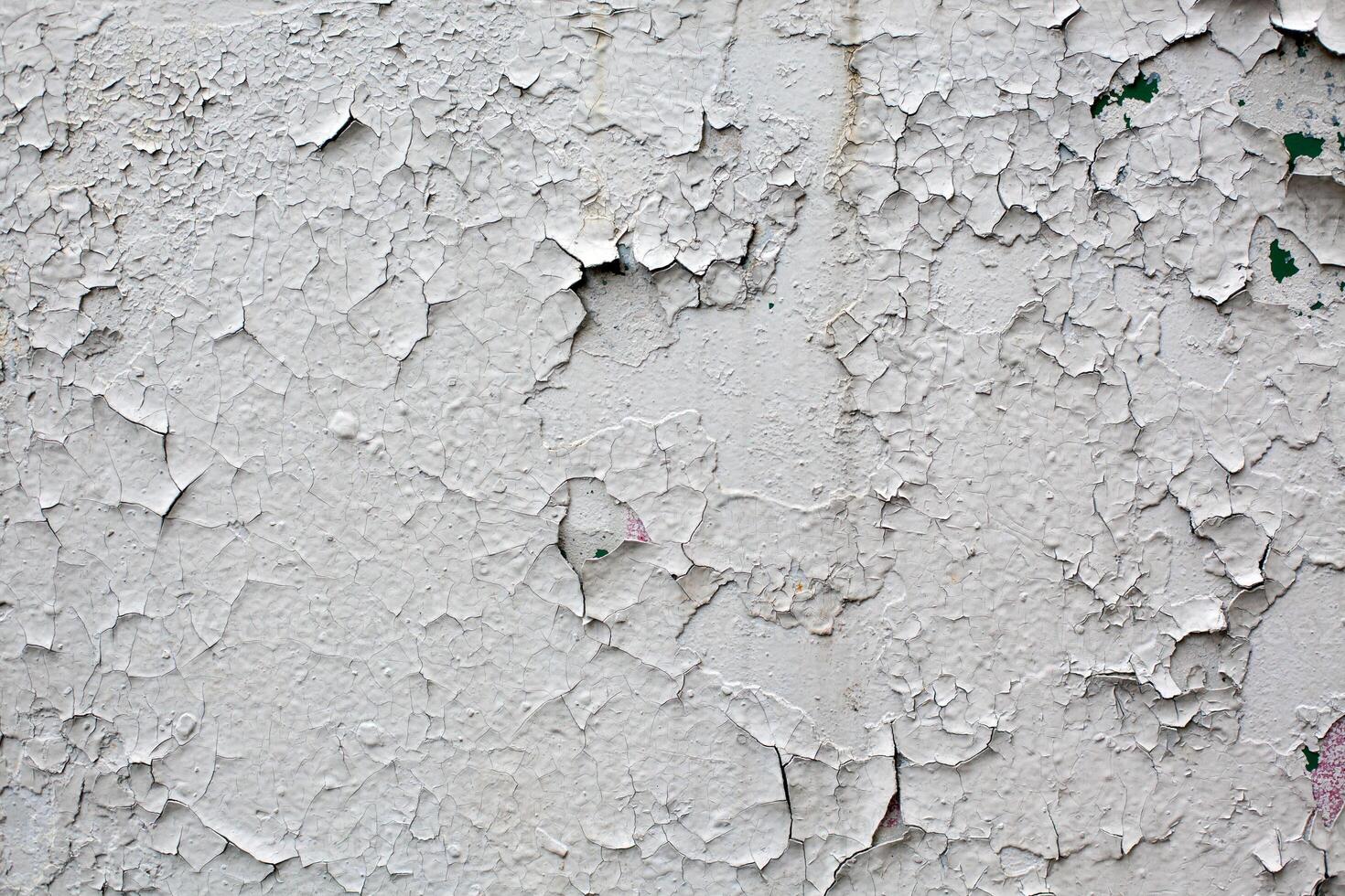 old gray cracked paint wall background photo