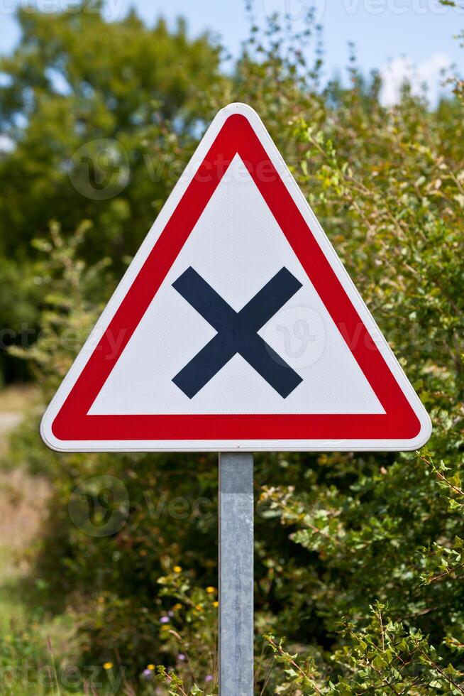 Crossroads road sign on a country road photo